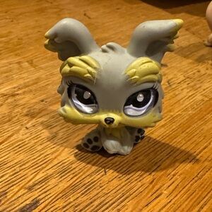 Gray and Yellow Toy Figure